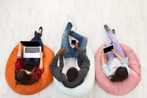 Gadgets and technology. Diverse people using smart devices, students preparing for exam at campus, top view